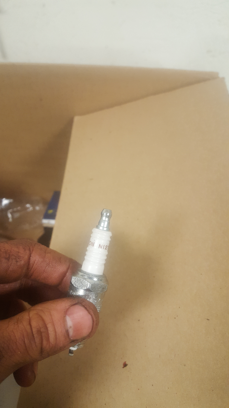 Those little caps on the spark plugs from Rock Auto aren’t removable (trust me, I tried) and the plug wires need to connect to a bare threaded stud, like on motorcycles. Even the new wires they sent me will not fit on these plugs. Fortunately, these were cheap and AutoZone had some correct ones in stock.